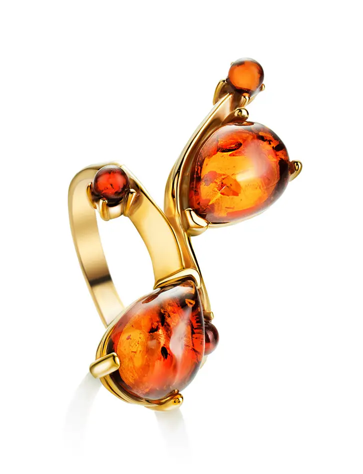 картинка Яркое и нарядное кольцо «Эврика» из золочённого серебра с коньячным янтарём в онлайн магазине