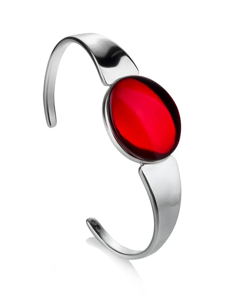 картинка Стильный жёсткий браслет, украшенный овальной янтарной вставкой «Сангрил» в онлайн магазине