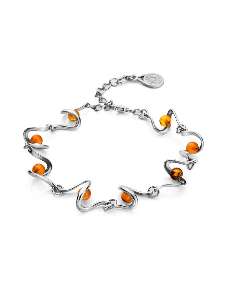 картинка Тонкий браслет из серебра, украшенный натуральным цельным янтарём коньячного цвета «Лея» в онлайн магазине