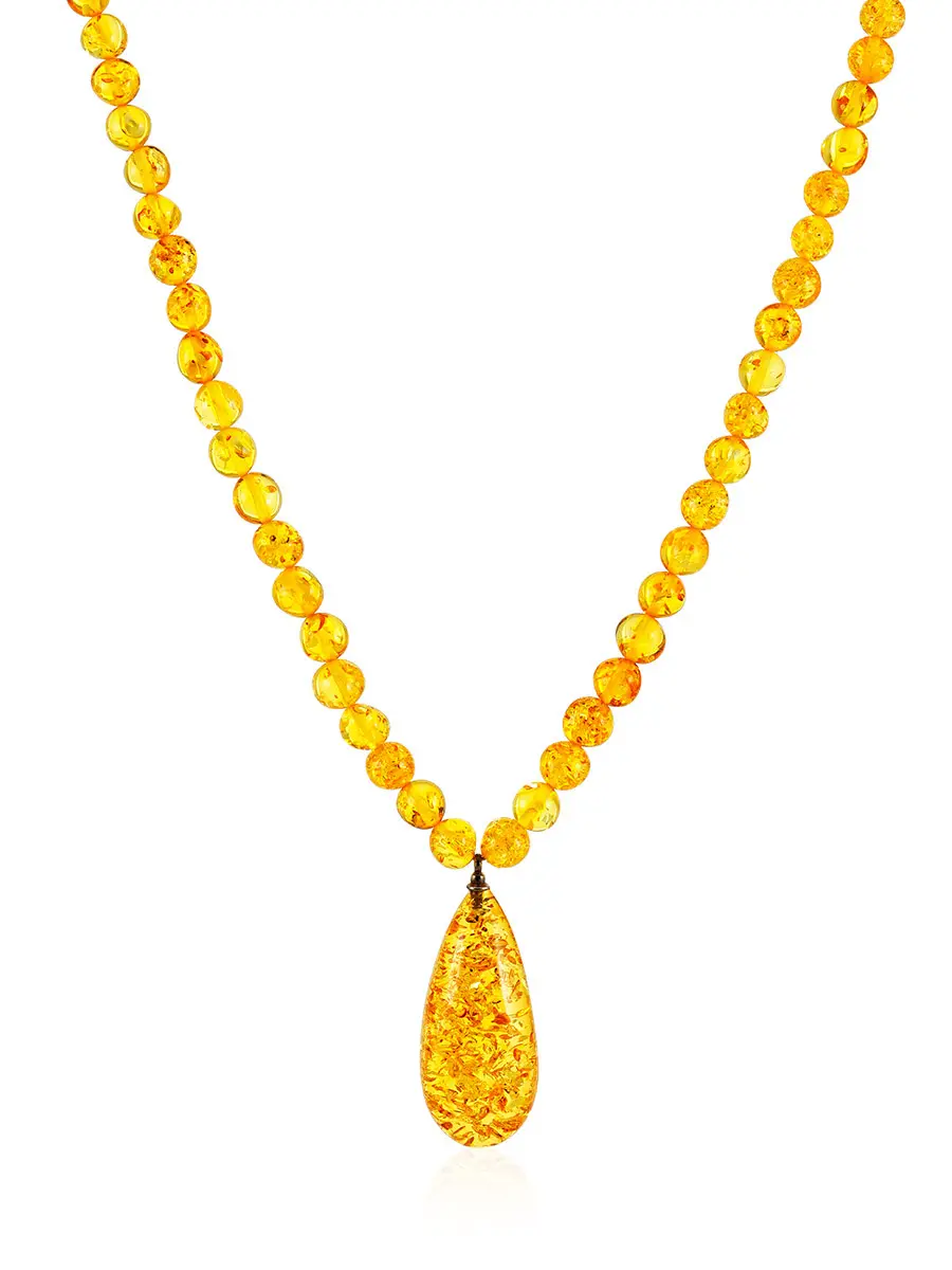 картинка Изящное ожерелье из бусин-шаров с подвеской из натурального искрящегося янтаря «Лаура» в онлайн магазине