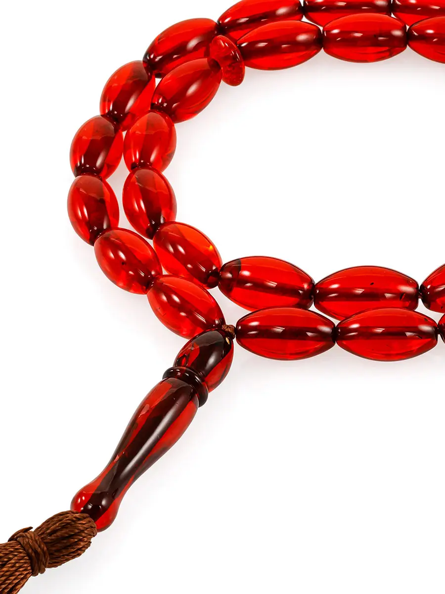 картинка Чётки мусульманские на 33 бусины-оливки из цельного янтаря красного цвета в онлайн магазине