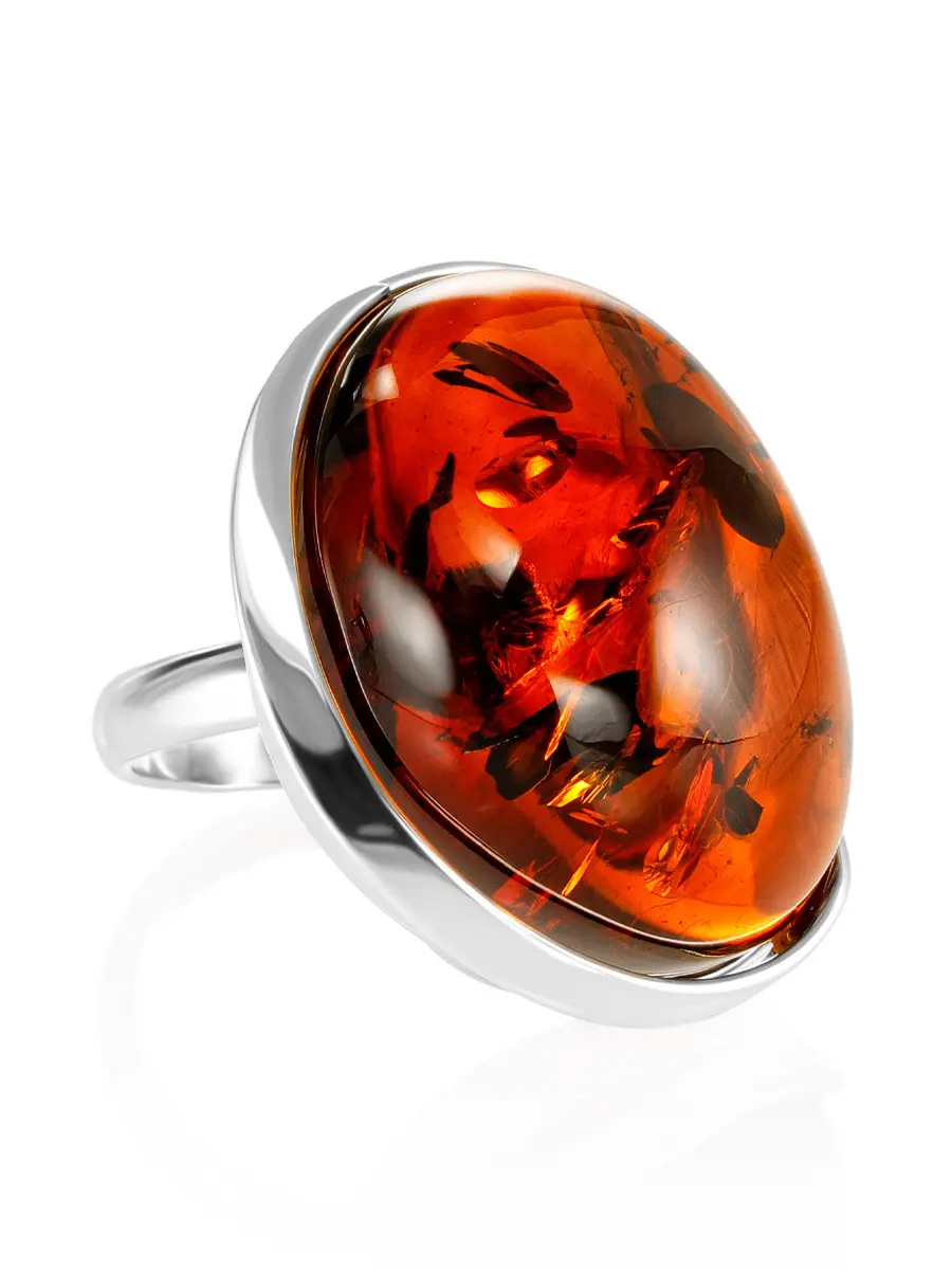 картинка Крупное объёмное кольцо с вставкой из насыщенного вишневого янтаря «Лагуна» в онлайн магазине