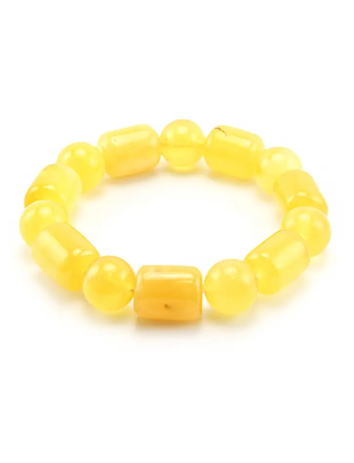 картинка Красивый светло-медовый янтарный браслет из бусин-шаров и цилиндров в онлайн магазине