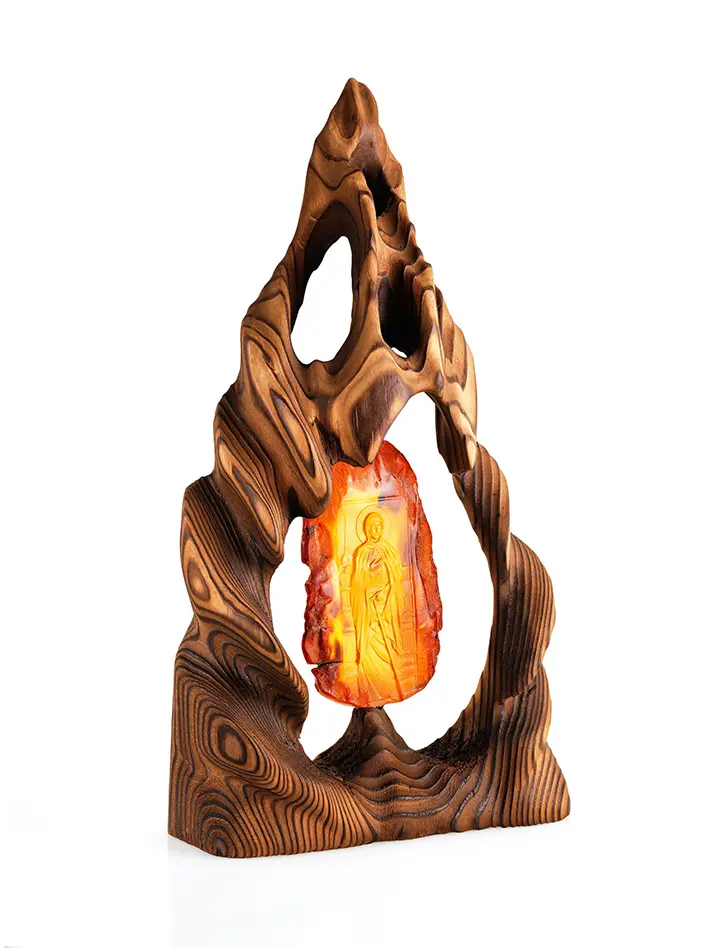 картинка Резная икона на натуральном цельном янтаре в деревянной оправе «Блаженная Ксения Петербургская» в онлайн магазине