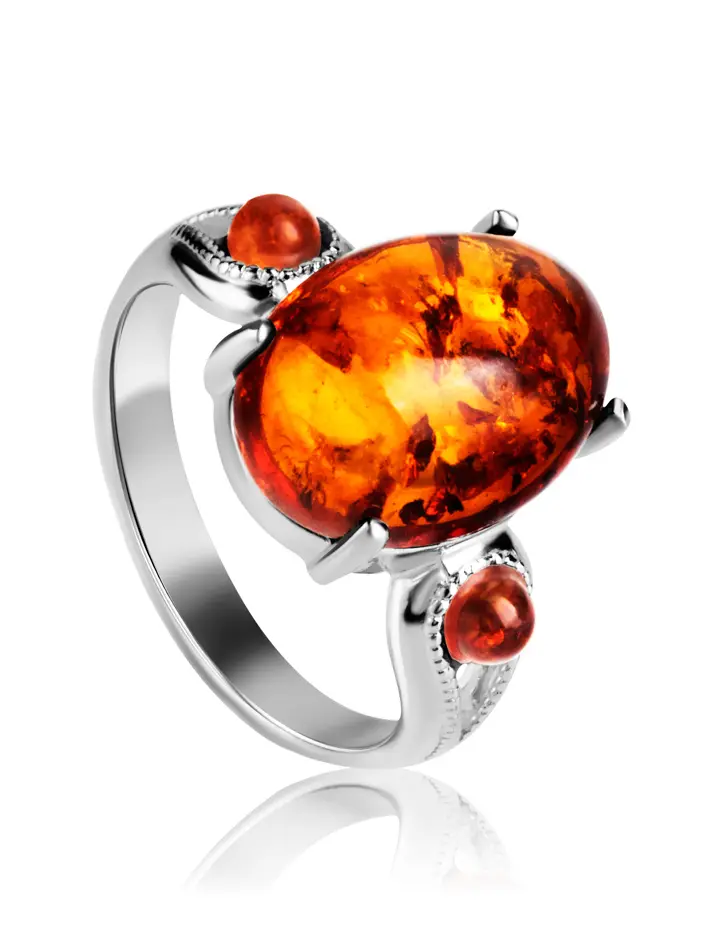 картинка Серебряное кольцо с натуральным искрящимся коньячным янтарем «Стамбул» в онлайн магазине