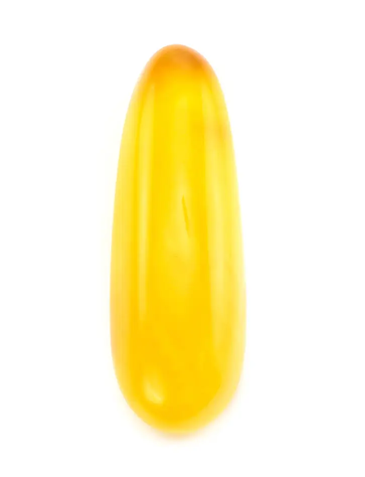 картинка Глянцевый кусочек янтаря яркого медового цвета удлиненной формы в онлайн магазине