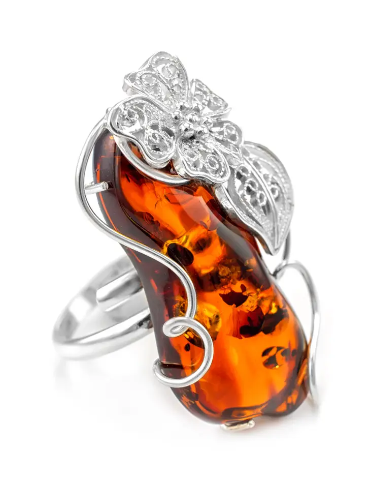 картинка Крупное нарядное кольцо с натуральным коньячным искрящимся янтарем «Филигрань» в онлайн магазине