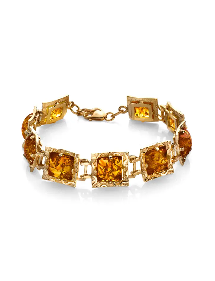 картинка Яркий браслет из позолоченного серебра и золотистого янтаря «Авангард» в онлайн магазине