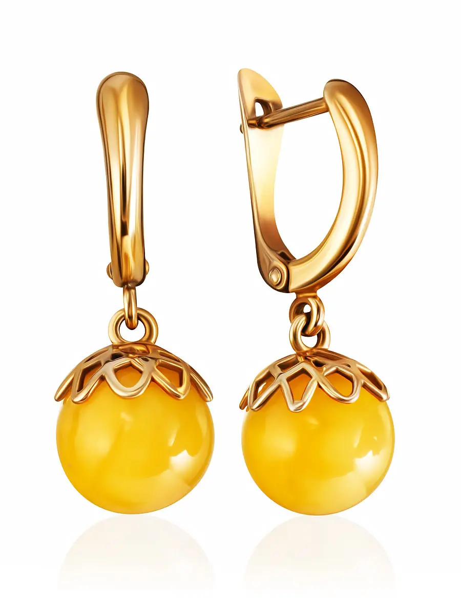 картинка Нежные серьги с подвесками-шариками из медового янтаря в онлайн магазине