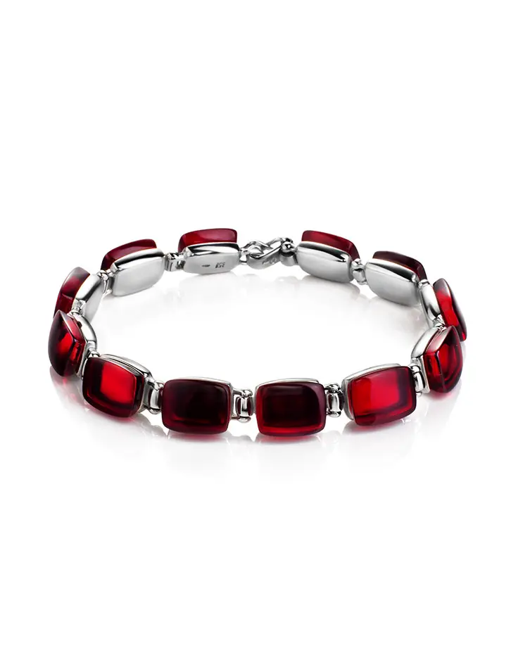картинка Яркий и стильный серебряный браслет «Сангрил» с красным янтарём в онлайн магазине
