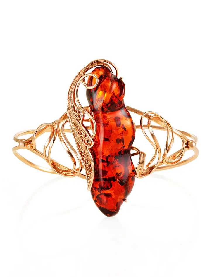 картинка Филигранный позолоченный браслет с крупным натуральным янтарем тёмно-коньячного цвета «Крылышко» в онлайн магазине