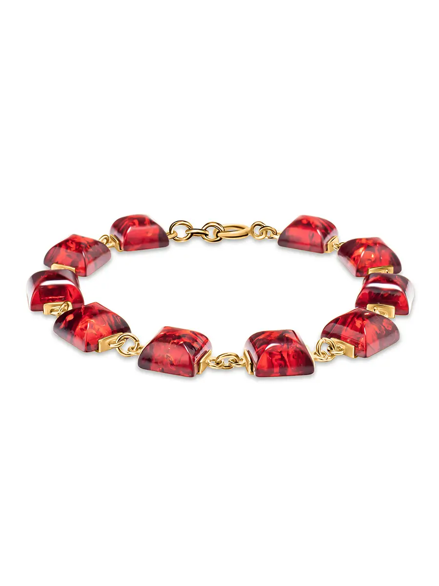 картинка Золочённый браслет «Овация», украшенный янтарём ярко-красного цвета в онлайн магазине