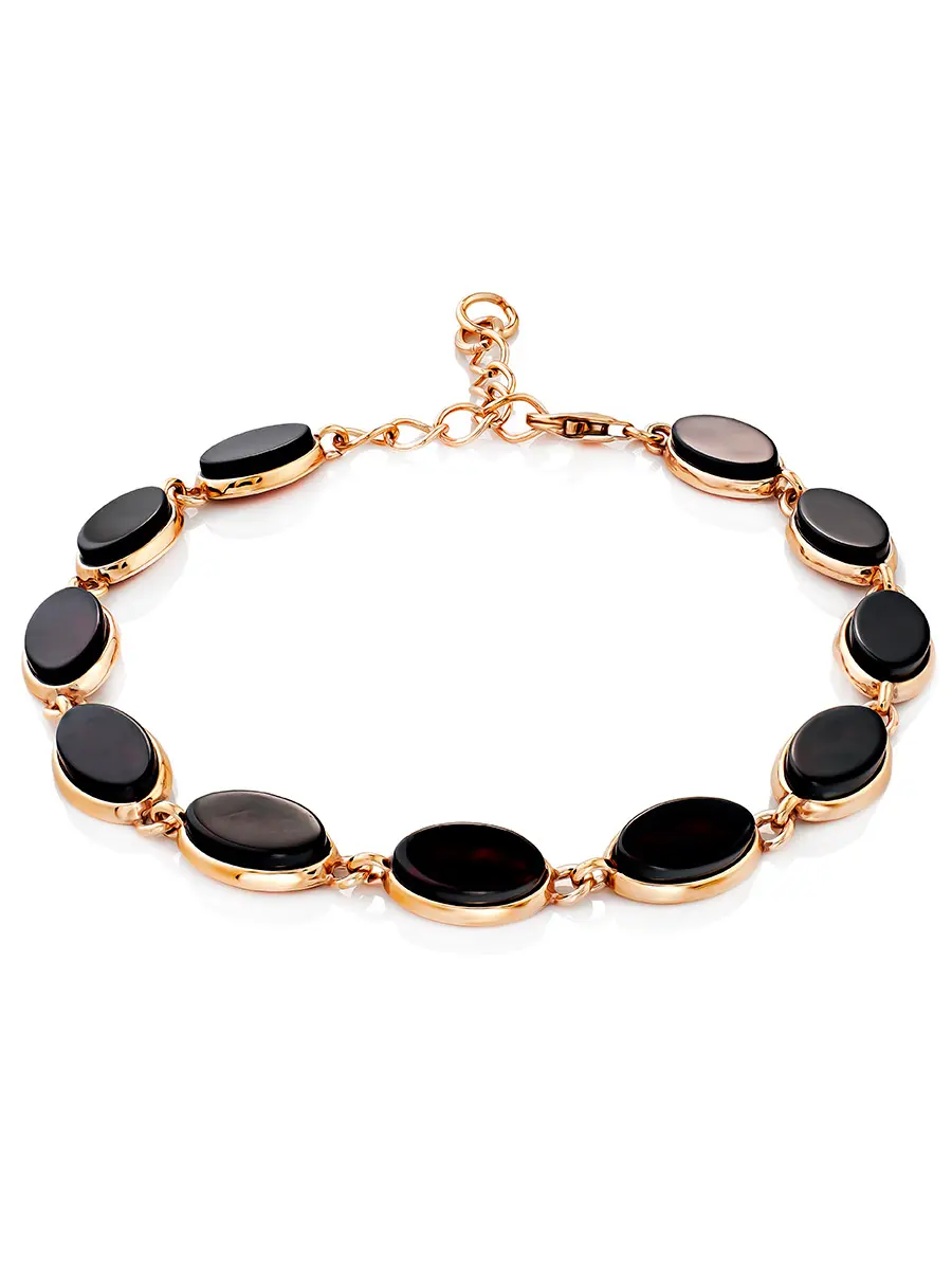картинка Яркий стильный браслет из позолоченного серебра и вишнёвого янтаря «Бенефис» в онлайн магазине