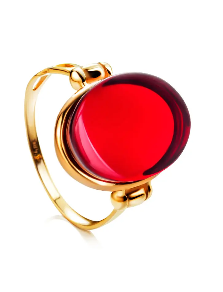 картинка Золотое кольцо с овальной вставкой из красного янтаря «Сангрил» в онлайн магазине