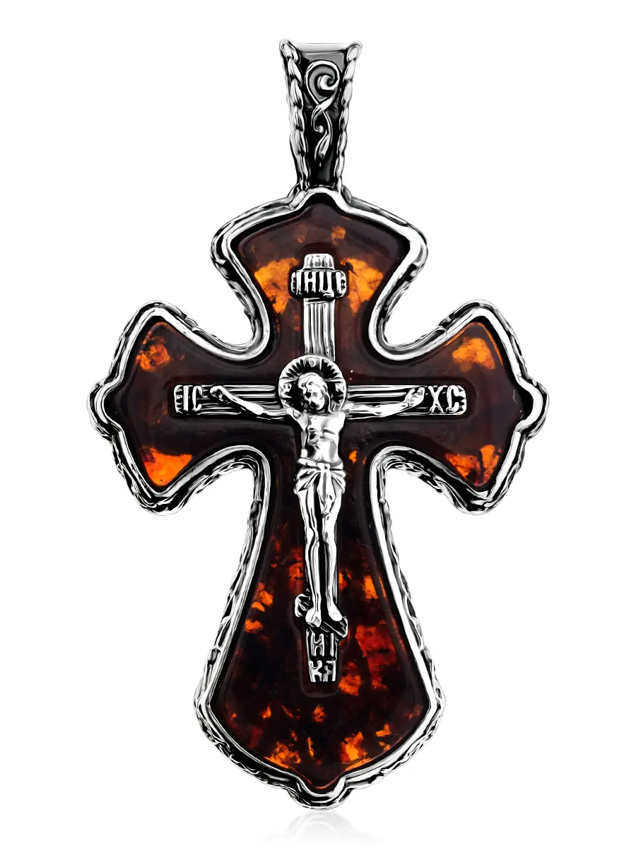 картинка Нательный крестик из полупрозрачного янтаря коньячного цвета в ажурном обрамлении в онлайн магазине