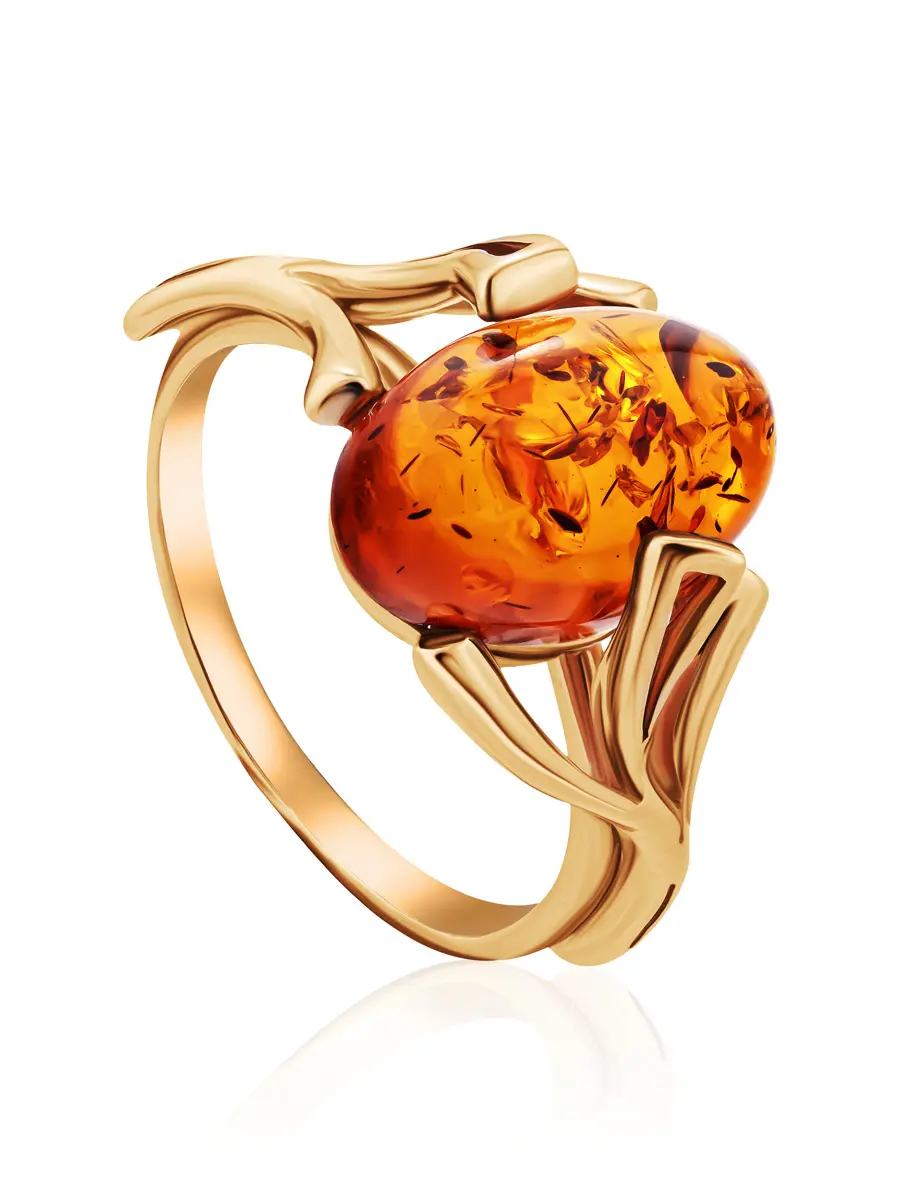картинка Женственное кольцо из золота с овальной вставкой из коньячного янтаря «Крокус» в онлайн магазине