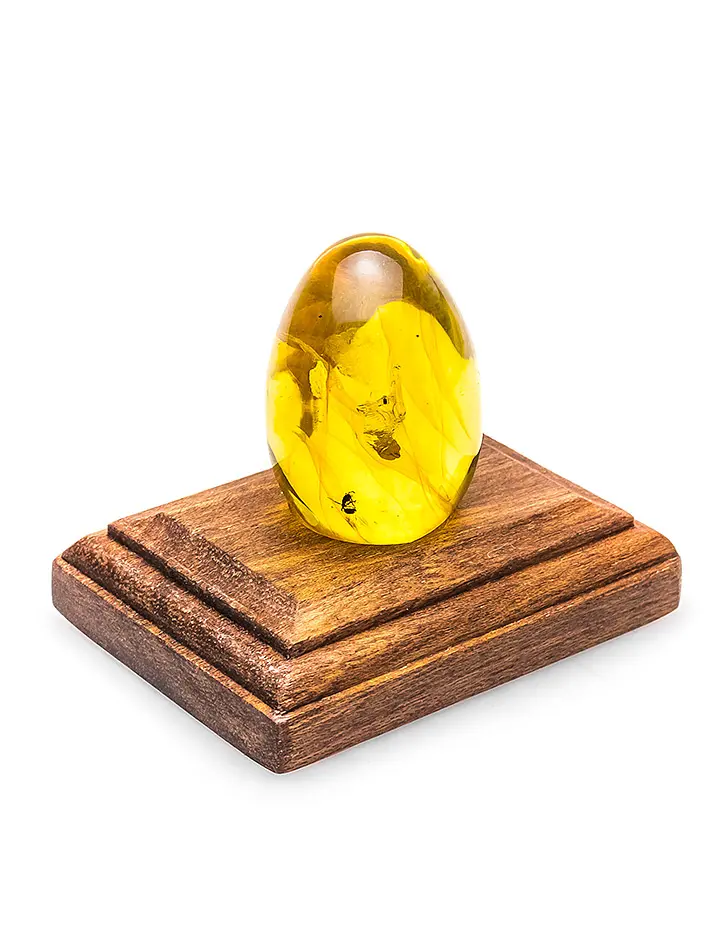 картинка Уникальное пасхальное яйцо из цельного лимонного янтаря с инклюзом муравья  в онлайн магазине