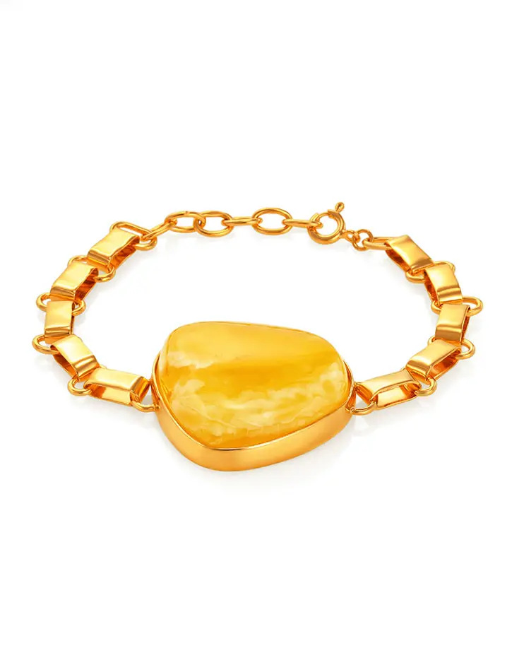 картинка Эффектный браслет из позолоченного серебра с натуральным цельным янтарём медового цвета в онлайн магазине