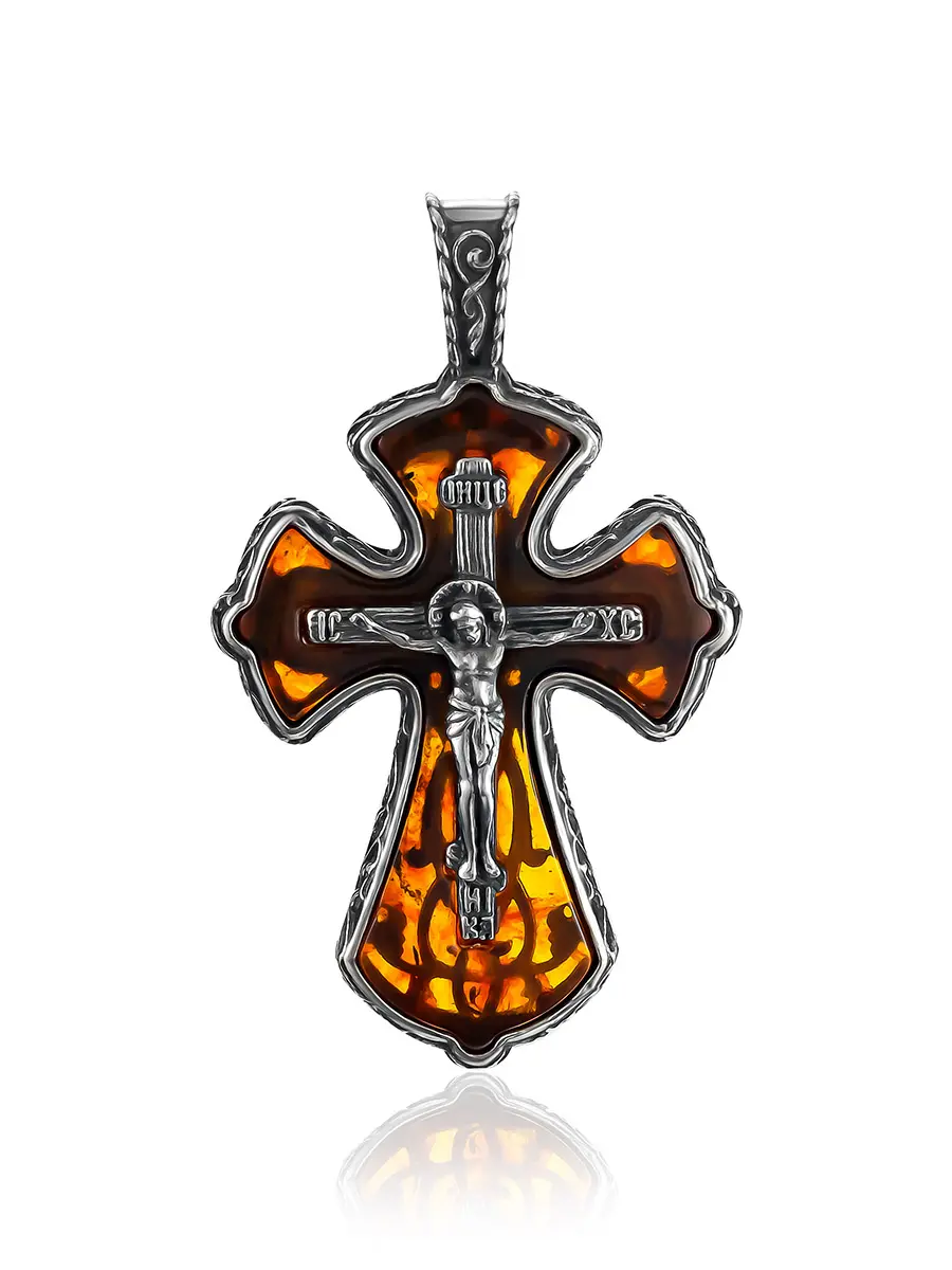 картинка Нательный крестик из полупрозрачного янтаря коньячного цвета в изящном обрамлении в онлайн магазине