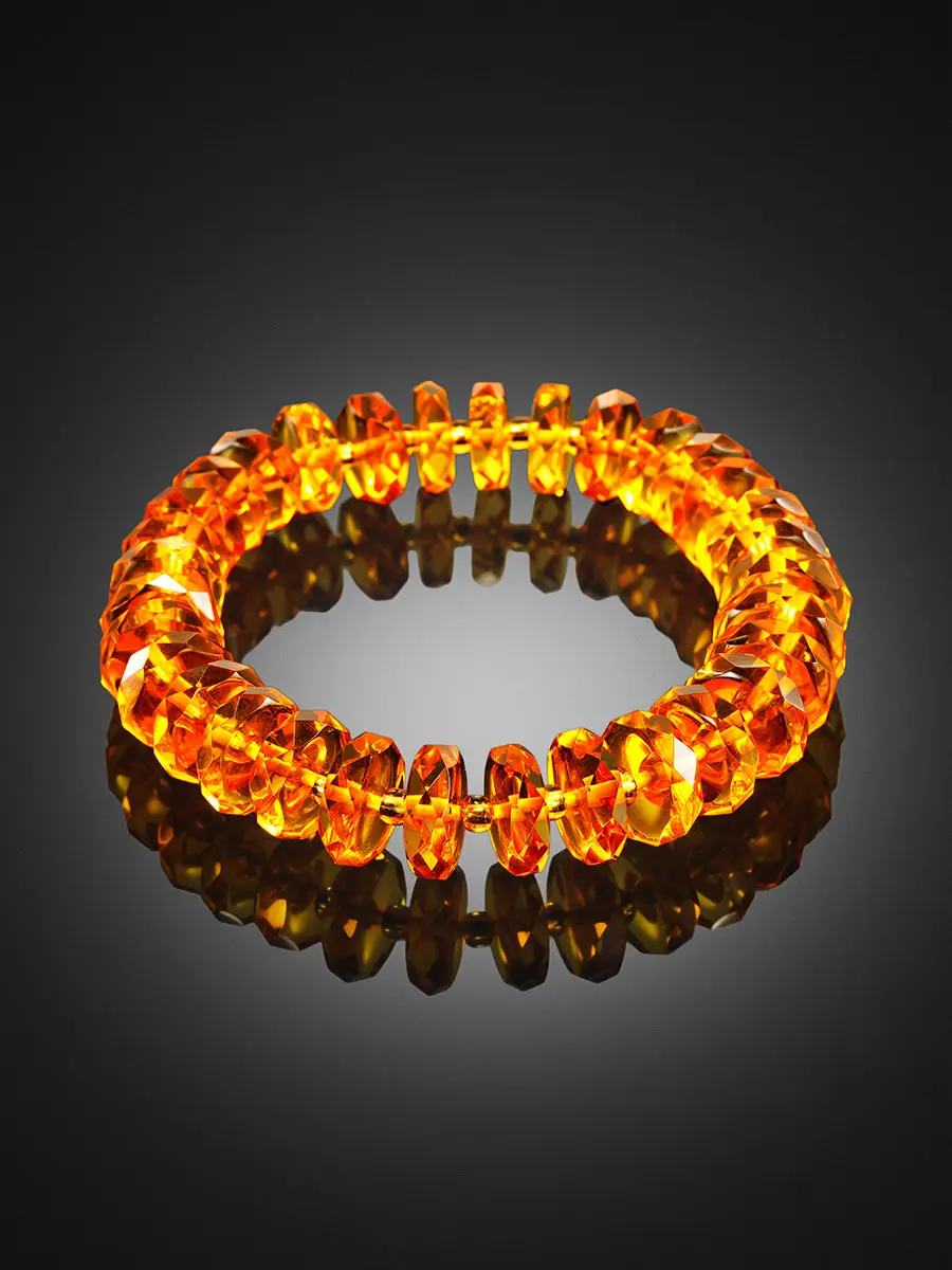картинка Яркий нарядный браслет из натурального золотистого янтаря «Алмазная шайба» в онлайн магазине
