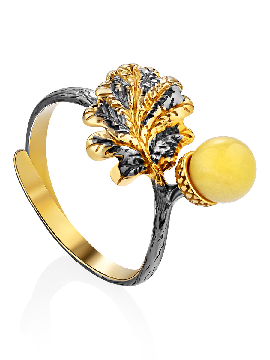 

Оригинальное серебряное кольцо с частичным золочением, украшенное янтарём «Жёлудь», Медовый